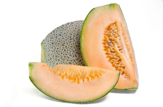 Cucumis melo Rockmelon Cantaloupe Honey dew melon fruits with orange juicy sweet flesh and seeds