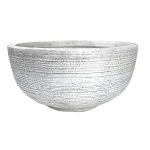 A round gray cement bowl with a horizontal ribbed texture, displayed from the side, showcases its GeoLite Squat Egg White Wash S 23x23cm design, adding subtle elegance to the aesthetic.