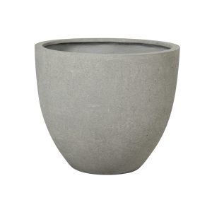 The UrbanCrete Deep Bowl Cement L 83x73cm is a round concrete planter in a subtle gray hue, featuring a smooth surface and a wide opening, ideal for displaying your plants in contemporary settings.