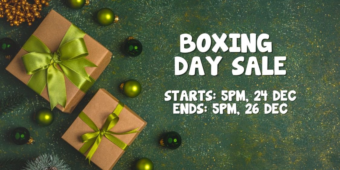 Announcing our Boxing Day Clearance! Dive into amazing deals with two gift boxes adorned with green ornaments. Sale kicks off at 5 PM on 24 Dec and wraps up at 5 PM on 26 Dec.