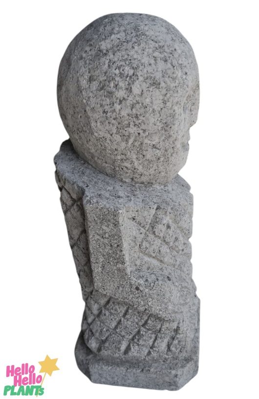 Side view of the Iridami Sumbawa Stone Tropman L 12x12x40cm sculpture showcases a geometric pattern and rounded head, echoing Dewi Sri's serene grace with its iridescent finish.